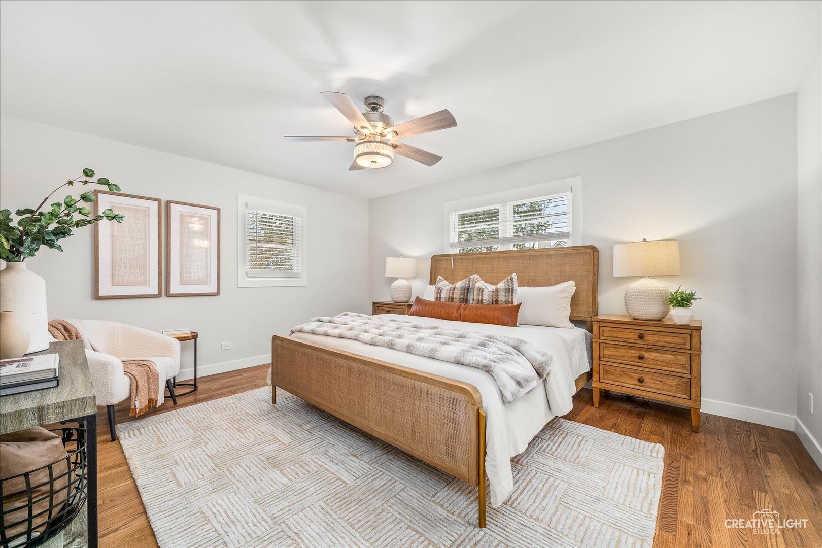 704 Plainfield Road Downers Grove, IL 60516 - Photo 15 of 36 a bedroom with a large bed and a chandelier