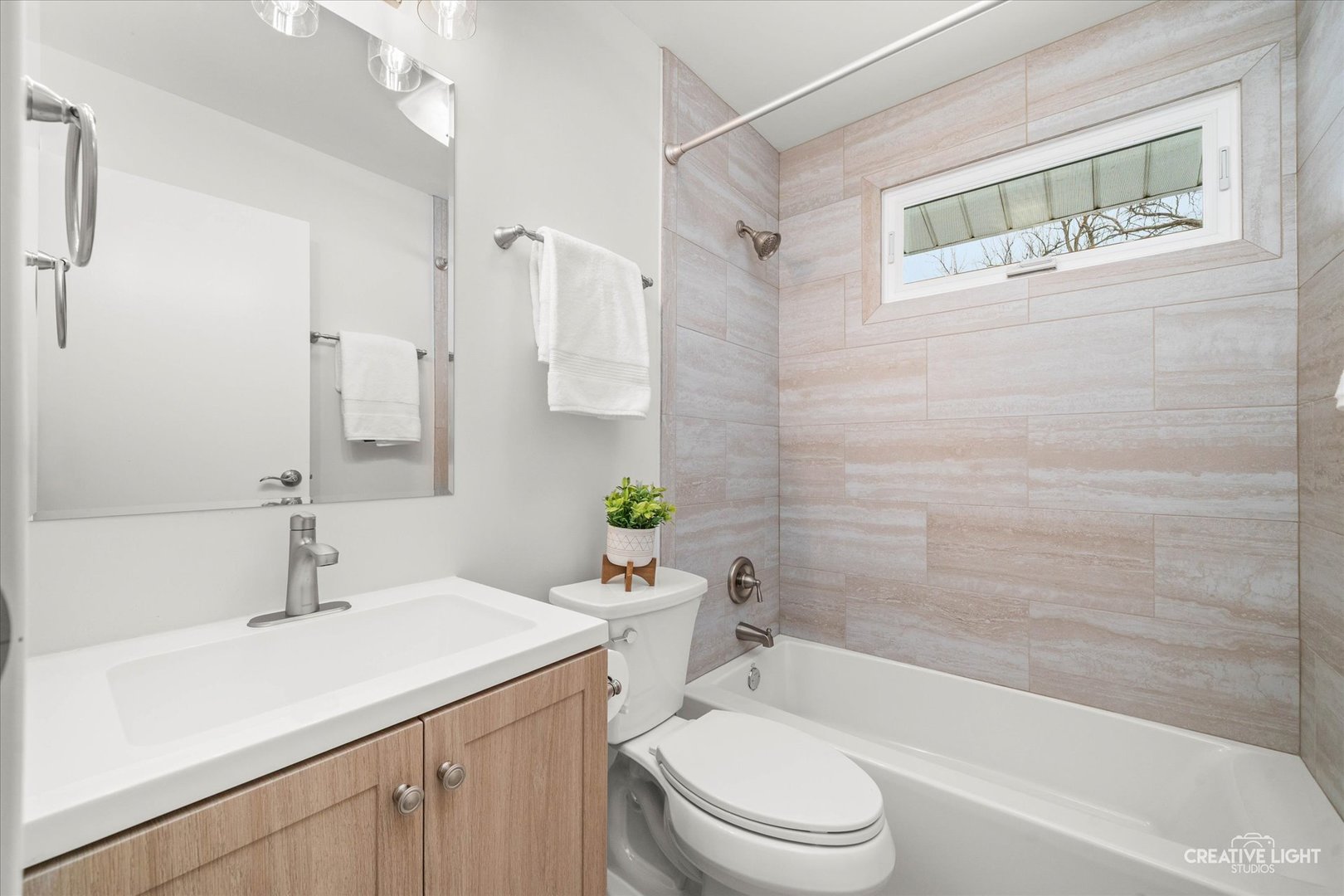 704 Plainfield Road Downers Grove, IL 60516 - Photo 21 of 36 a bathroom with a sink a toilet and shower