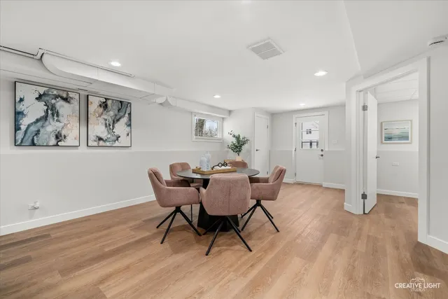 a view of a livingroom with furniture and wooden floor