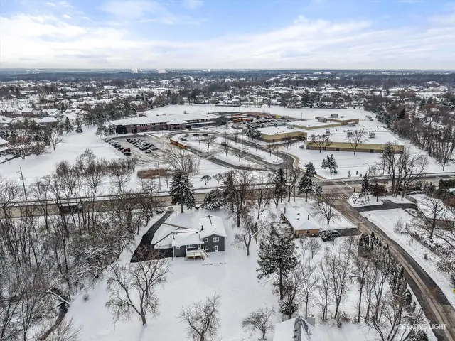 a front view of a house with a sign board