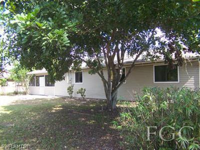 17404 Oriole Road Fort Myers, FL 33967 - Photo 2 of 3 a view of a house with a tree