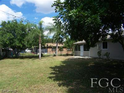 17404 Oriole Road Fort Myers, FL 33967 - Photo 3 of 3 a view of a house with backyard and trees