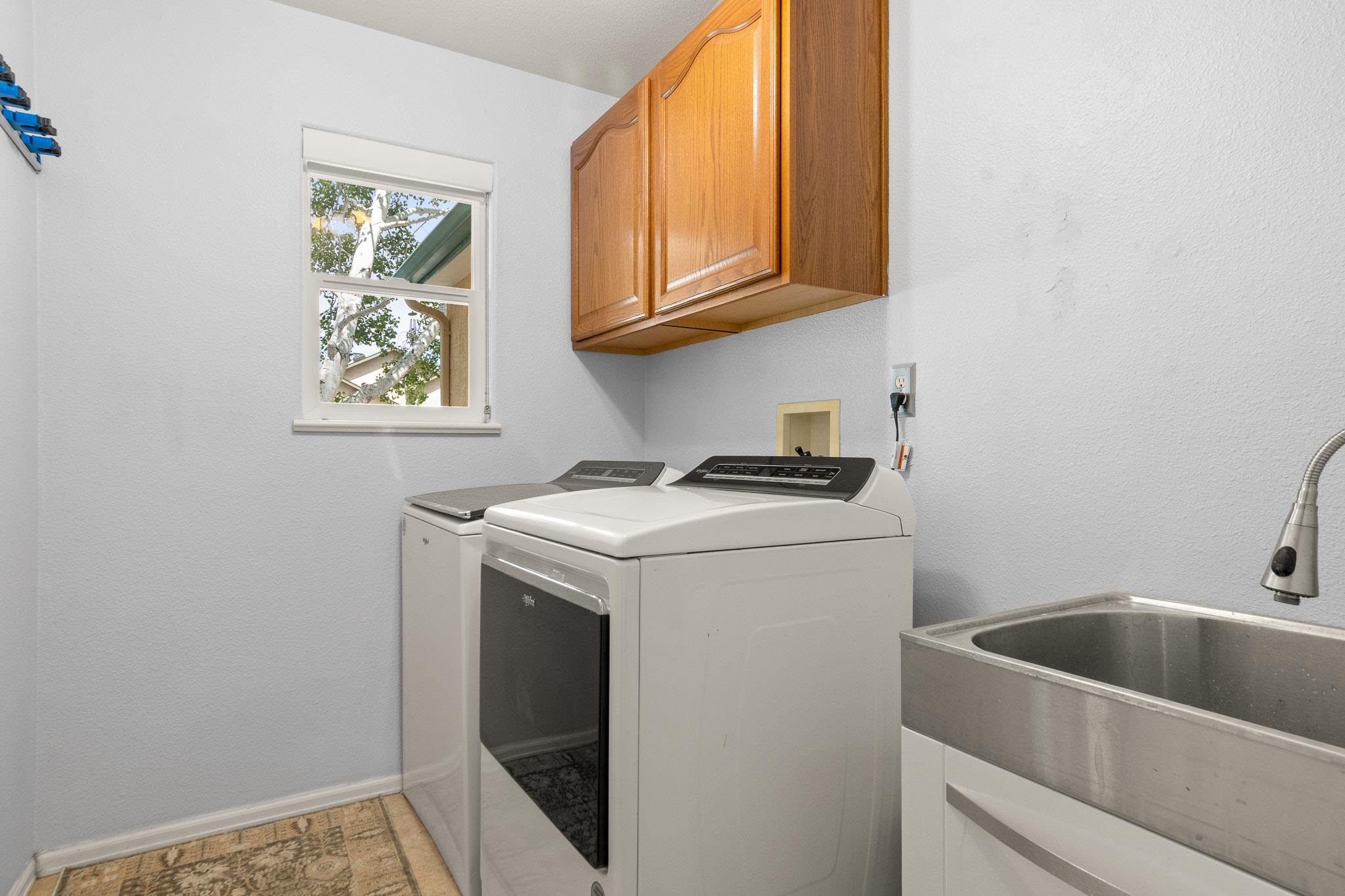 398 Butte Court Grand Junction, CO 81507 - Photo 19 of 33 a utility room with dryer and washer