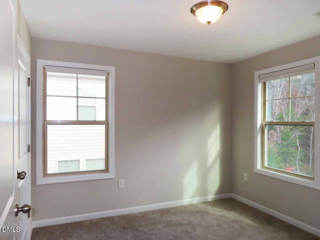 1217 Compass Drive Durham, NC 27713 - Photo 17 of 29 an empty room with windows
