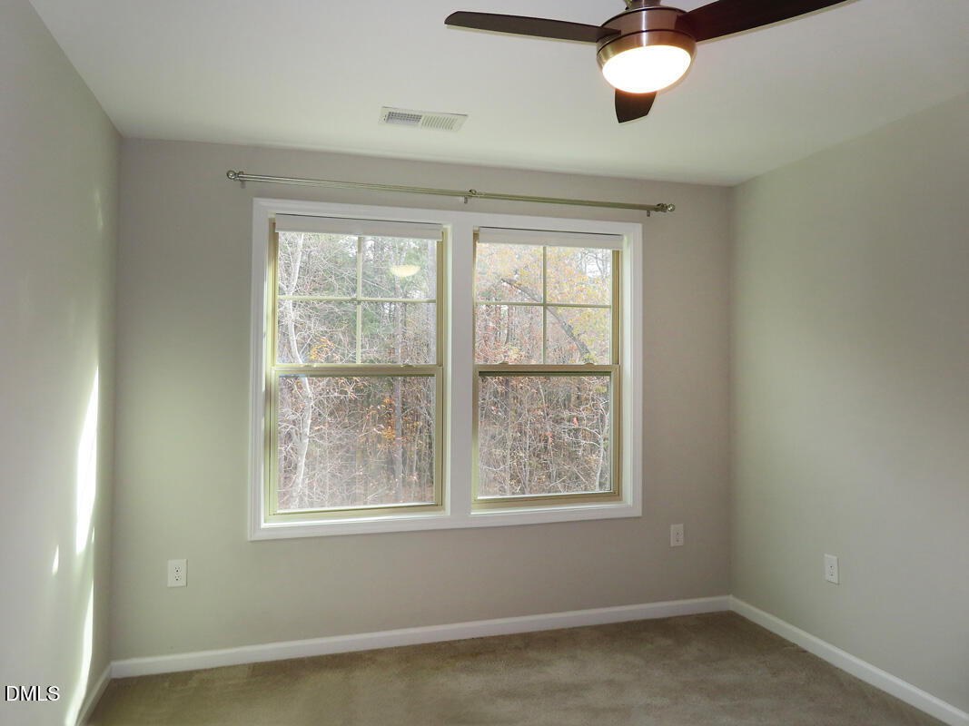 1217 Compass Drive Durham, NC 27713 - Photo 18 of 29 an empty room with a window