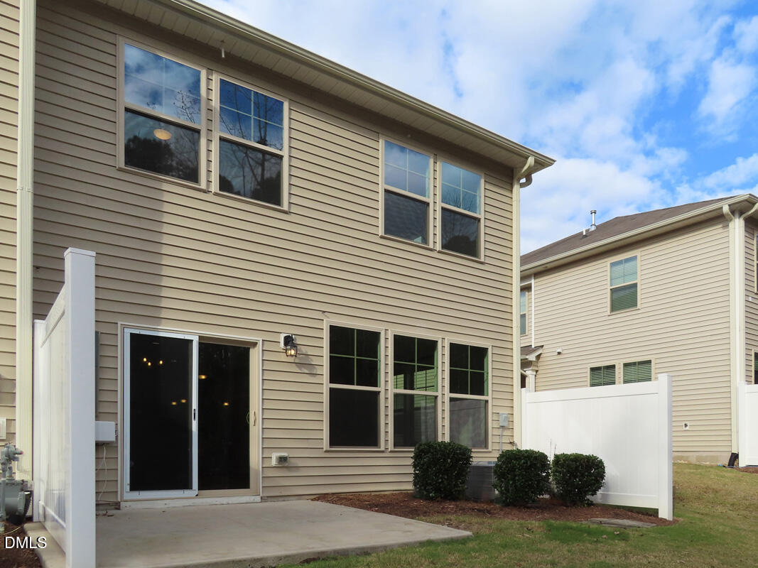 1217 Compass Drive Durham, NC 27713 - Photo 25 of 29 a view of a house with a yard