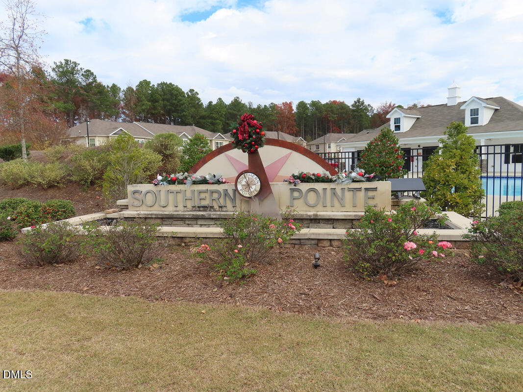 1217 Compass Drive Durham, NC 27713 - Photo 28 of 29 an aerial view of a house with a garden and lake view