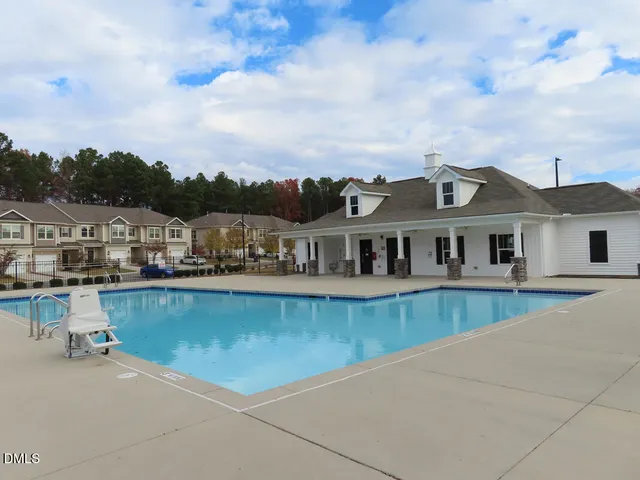an aerial view of a house with pool