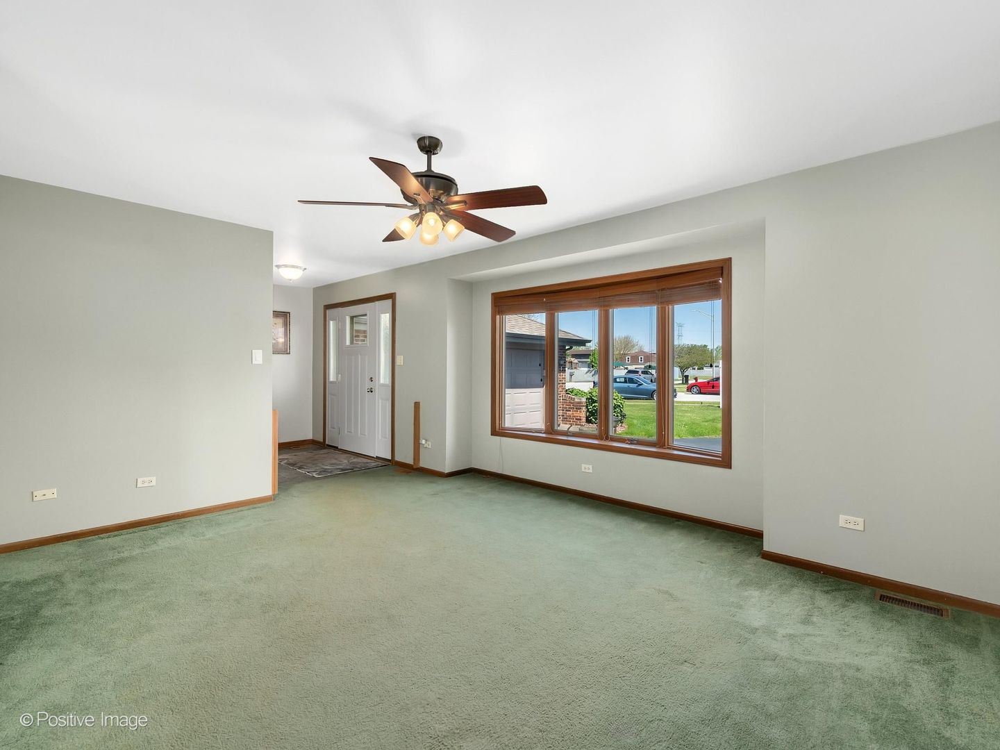 3235 192nd Street Lansing, IL 60438 - Photo 3 of 28 an empty room with windows and entrance
