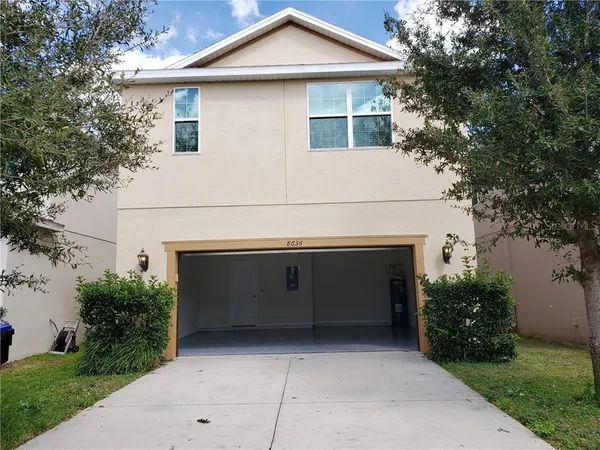 a front view of a house with garage