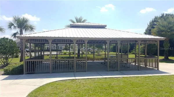 a view of a house with backyard and porch