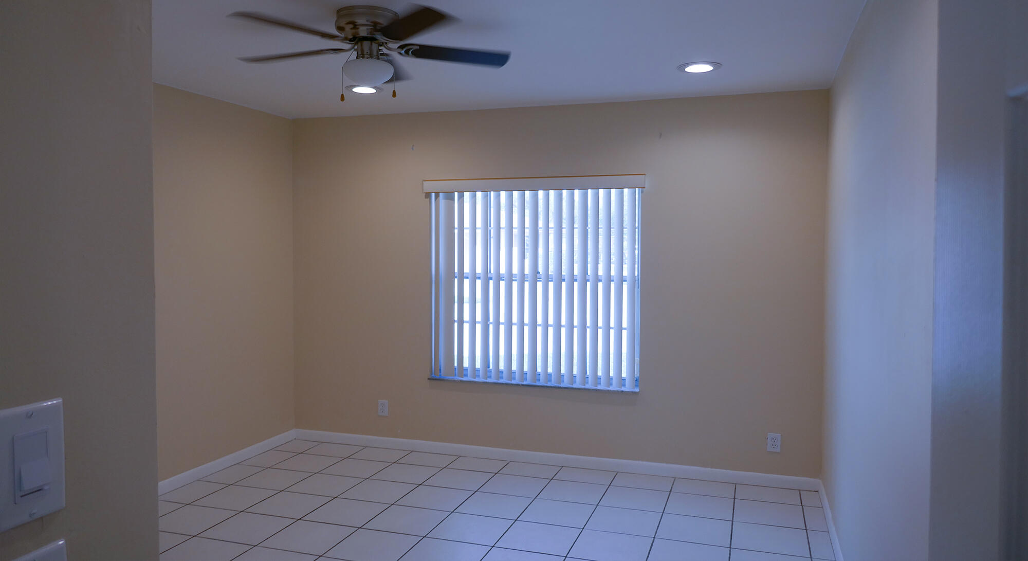 9861 Three Lakes Circle Boca Raton, FL 33428 - Photo 11 of 21 an empty room with windows and fan