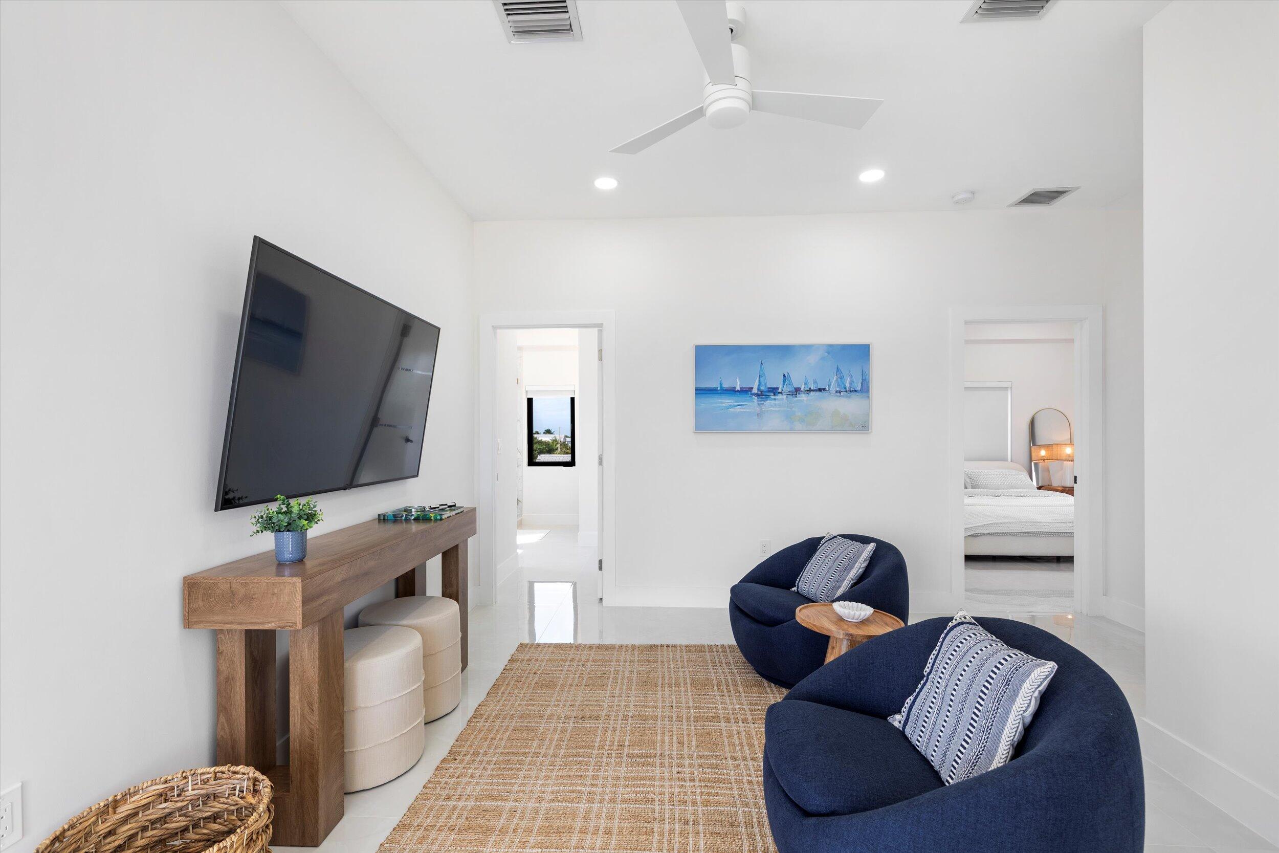 27433 Antigua Road Summerland Key, FL 33042 - Photo 39 of 64 a living room with furniture and a flat screen tv