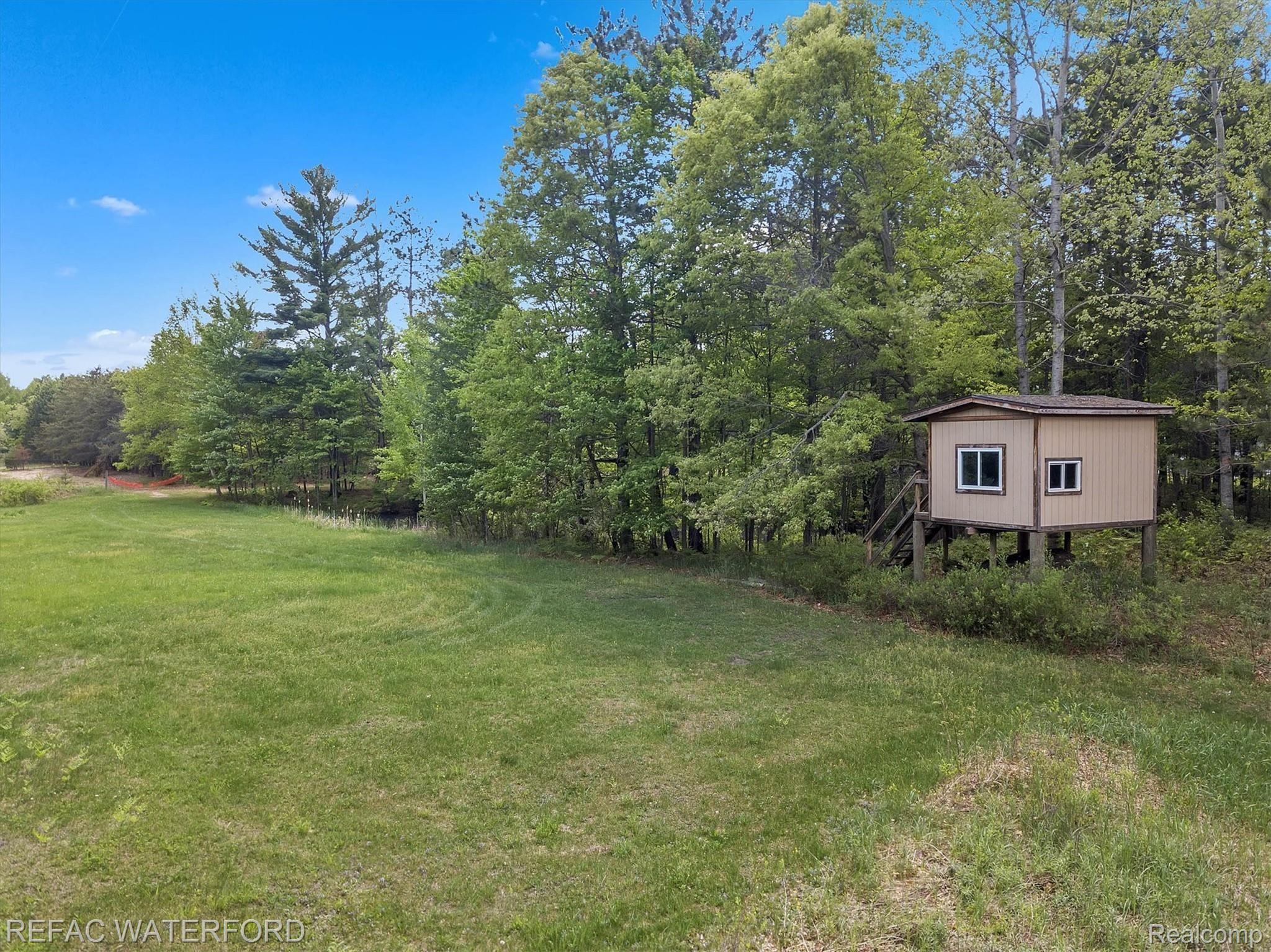 480 Roscommon Road Roscommon, MI 48653 - Photo 65 of 65 One of the deer blinds on the property near pond. Trail wide enough to drive to.