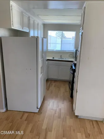 a view of kitchen and utility room