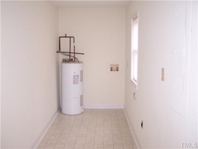 804 Variform Road Durham, NC 27712 - Photo 8 of 12 a view of a storage & utility room with a door