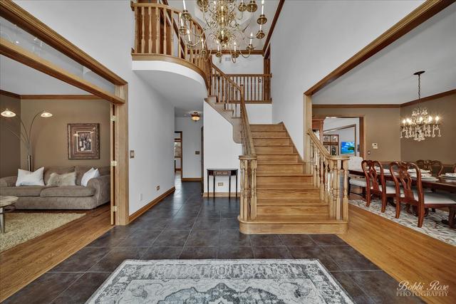 2809 Turnberry Road St. Charles, IL 60174 - Photo 4 of 21 a view of entryway and hall with wooden floor