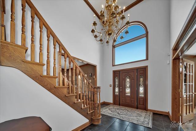 2809 Turnberry Road St. Charles, IL 60174 - Photo 5 of 21 a view of entryway and hall with wooden floor