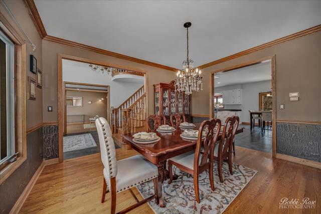 2809 Turnberry Road St. Charles, IL 60174 - Photo 7 of 21 a dining room with furniture window and wooden floor