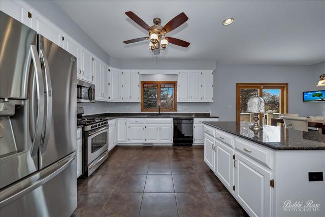 2809 Turnberry Road St. Charles, IL 60174 - Photo 10 of 21 a kitchen with stainless steel appliances a sink stove and refrigerator