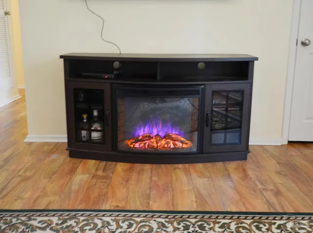a stove top oven sitting inside of a kitchen