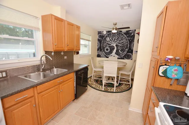 a kitchen with a stove and a sink