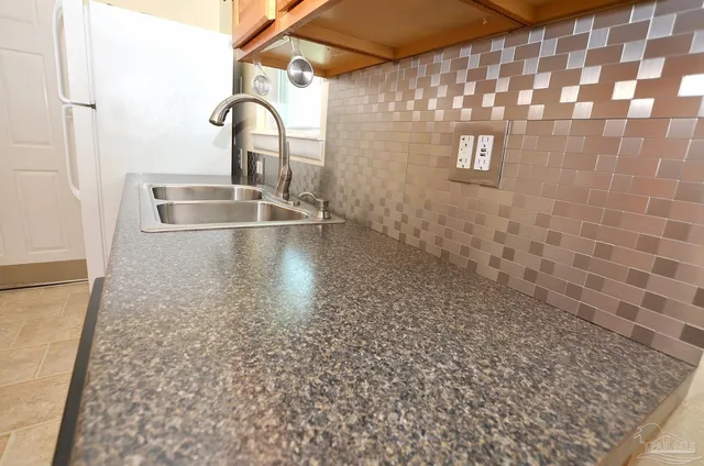 a view of a bathroom from a hallway