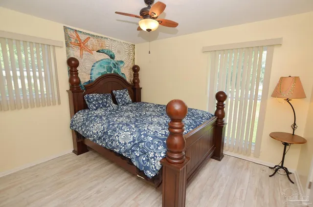 a white toilet sitting next to a bath tub