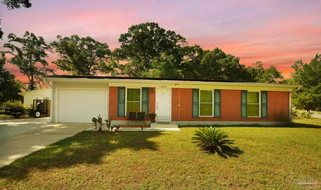 a house view with swimming pool in front of it