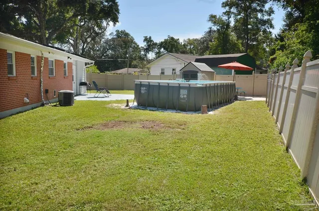 an aerial view of a house with outdoor space