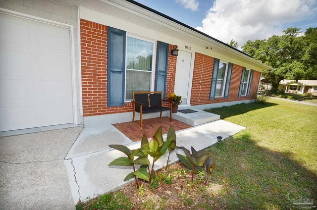 a living room with a couch and a fireplace