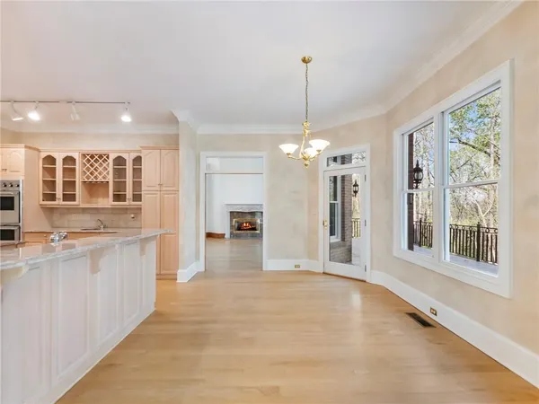 a view of an empty room with glass door