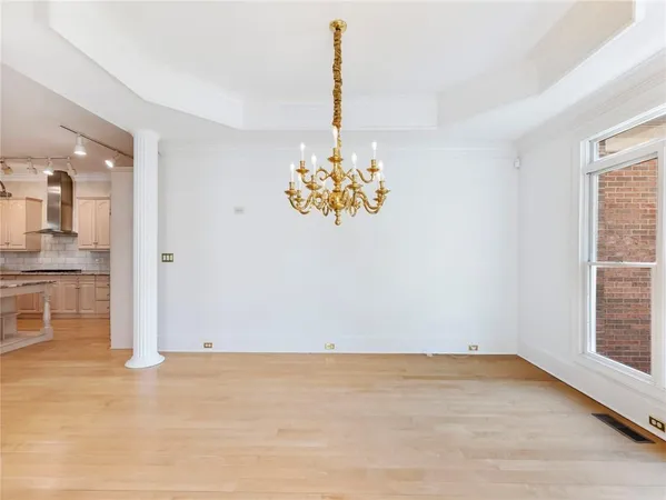 a view of entryway and hallway with wooden floor