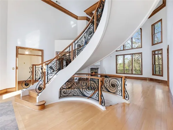 a view of an entryway with wooden floor