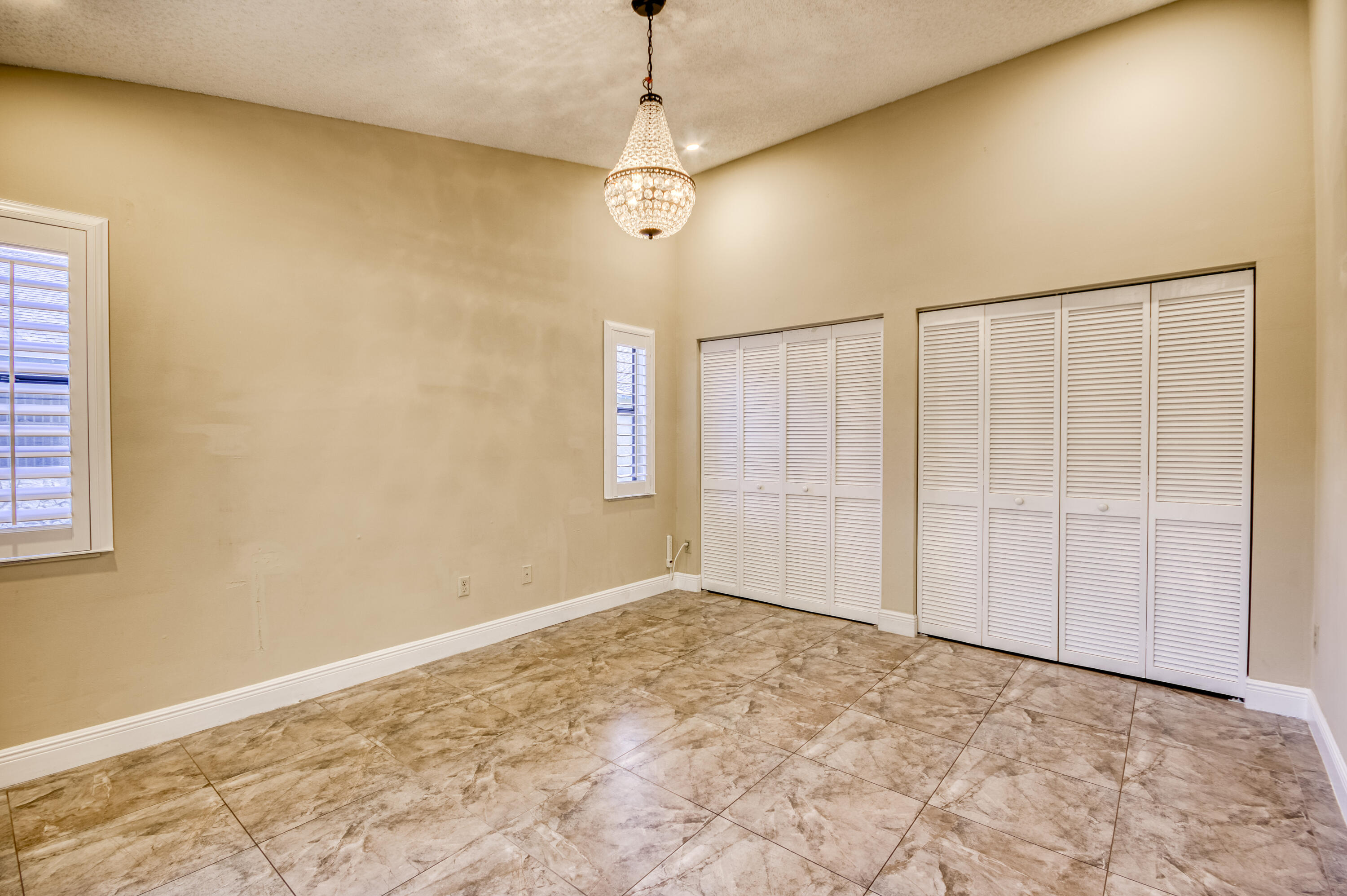 9109 Southwest 21st Street, Unit E Boca Raton, FL 33428 - Photo 11 of 24 a view of a room with a empty space