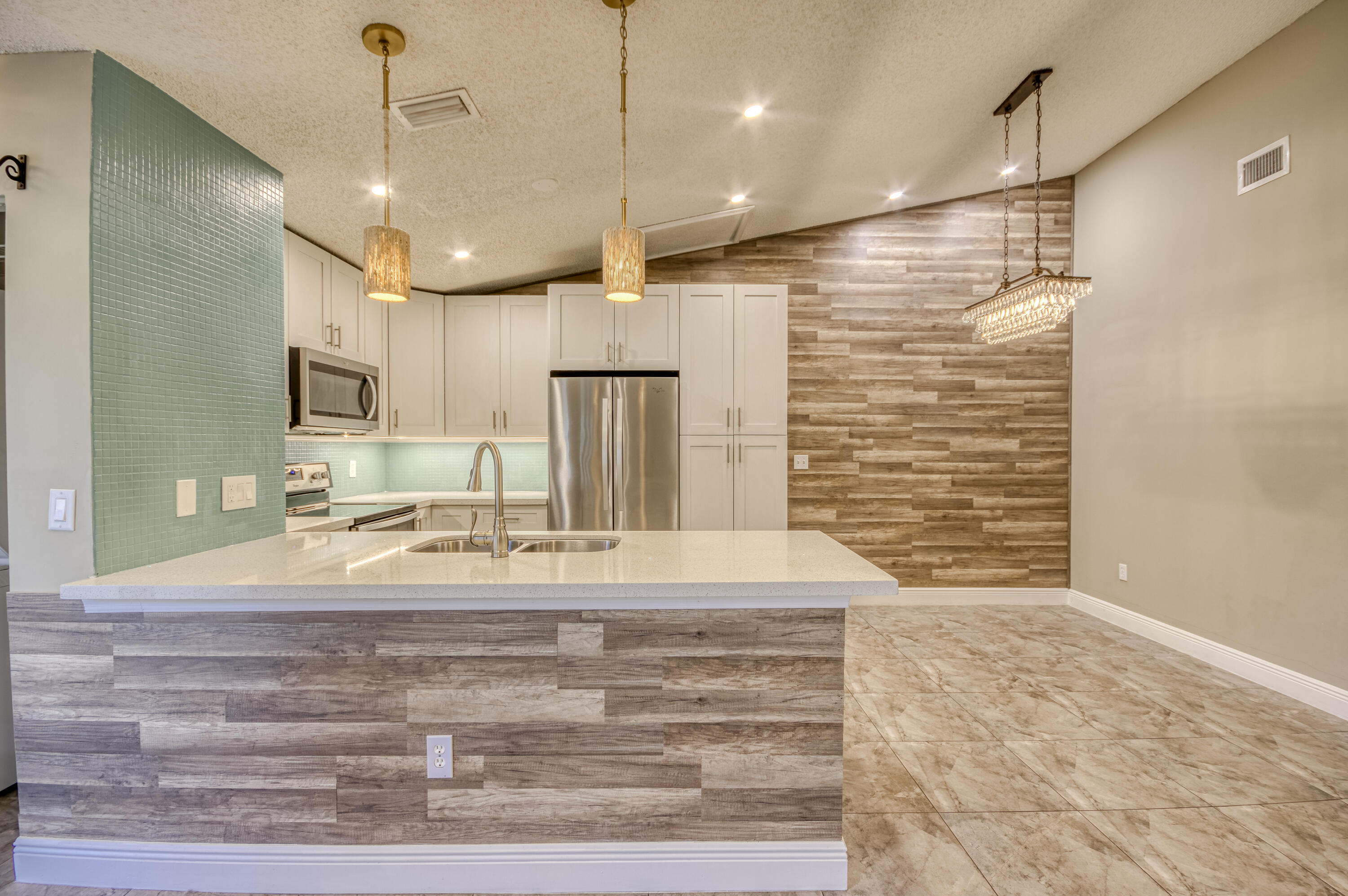 9109 Southwest 21st Street, Unit E Boca Raton, FL 33428 - Photo 7 of 24 a bathroom with a sink and a shower