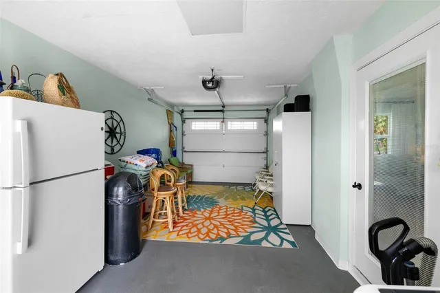 a building outdoor space with patio furniture and potted plants