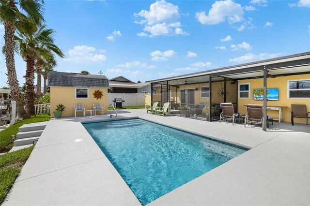 a view of a lake with chairs
