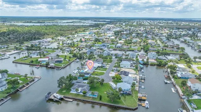 an aerial view of residential house with outdoor space