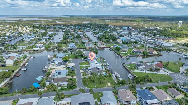 an aerial view of a house with a lake view