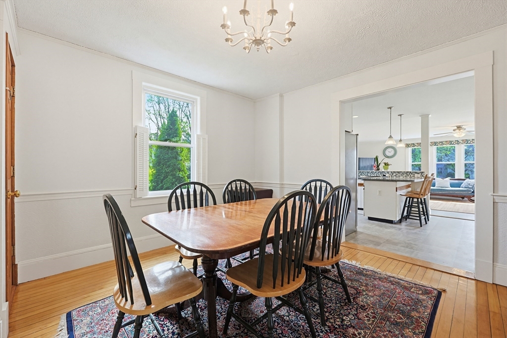 24 Riverside Place Walpole, MA 02081 - Photo 12 of 39 a view of a dining room with furniture window and wooden floor
