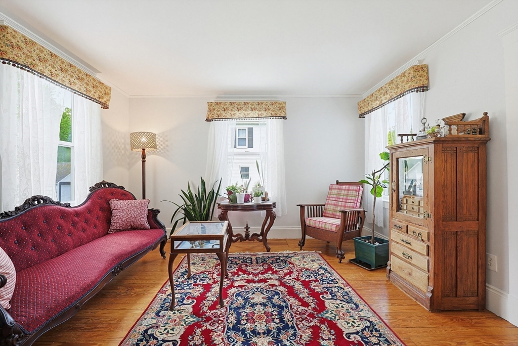 24 Riverside Place Walpole, MA 02081 - Photo 14 of 39 a living room with furniture and a rug