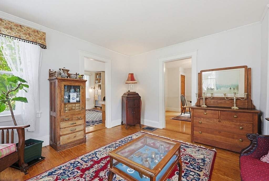 24 Riverside Place Walpole, MA 02081 - Photo 15 of 39 a living room with furniture and a wooden floor