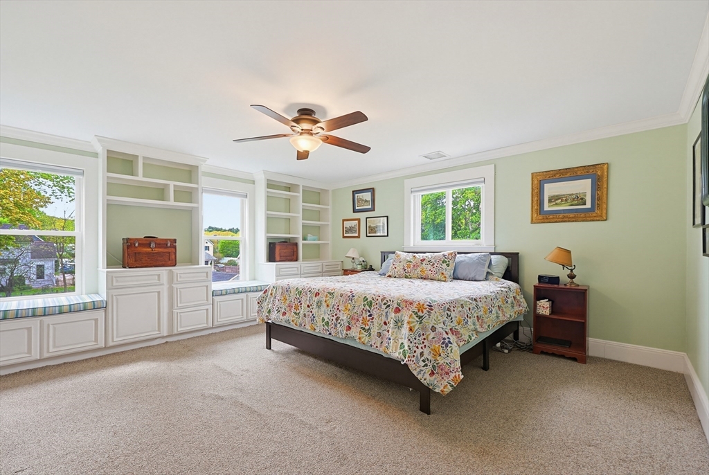 24 Riverside Place Walpole, MA 02081 - Photo 18 of 39 a bed room with a bed and a large window