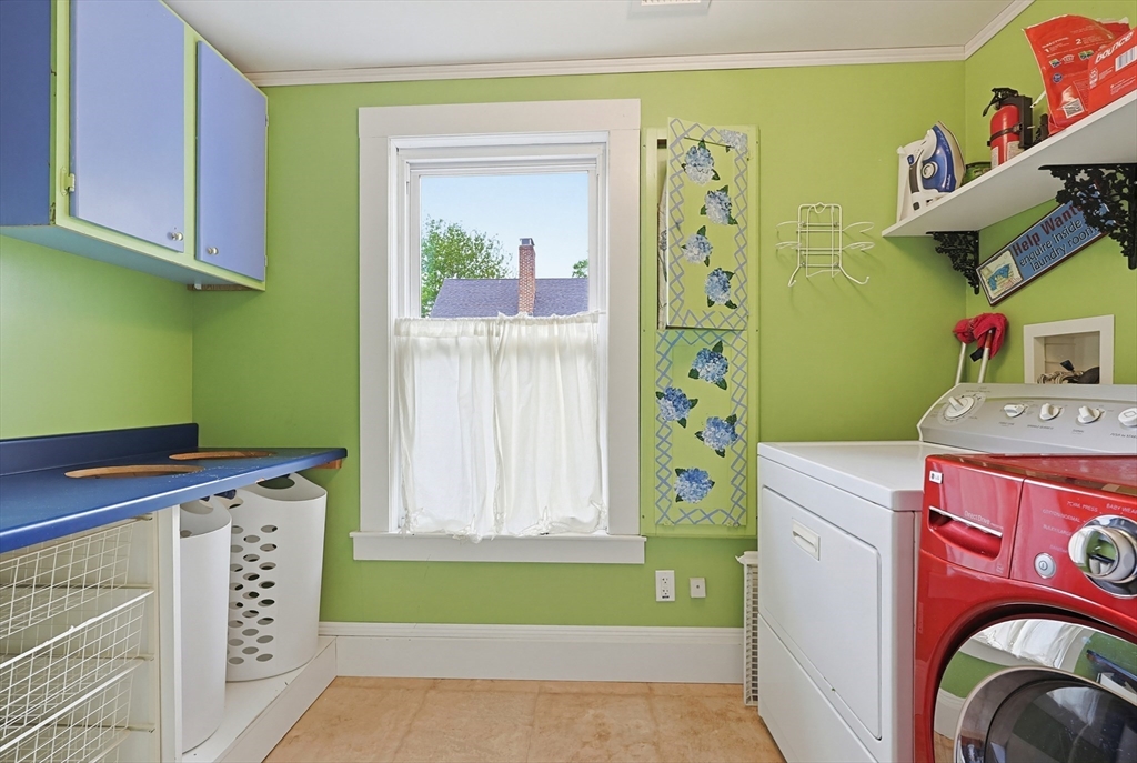 24 Riverside Place Walpole, MA 02081 - Photo 24 of 39 a utility room with dryer and washer