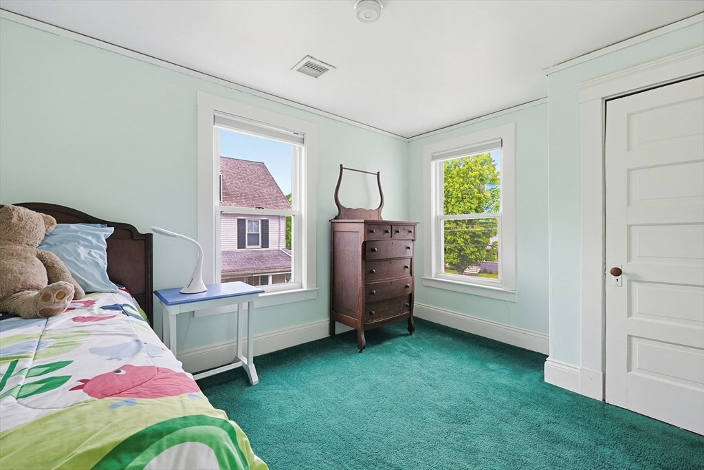 24 Riverside Place Walpole, MA 02081 - Photo 27 of 39 a bedroom with bed and a window