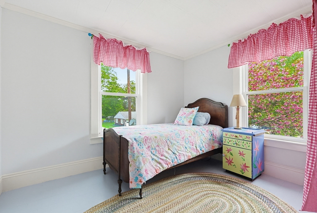24 Riverside Place Walpole, MA 02081 - Photo 29 of 39 a bedroom with a bed and window