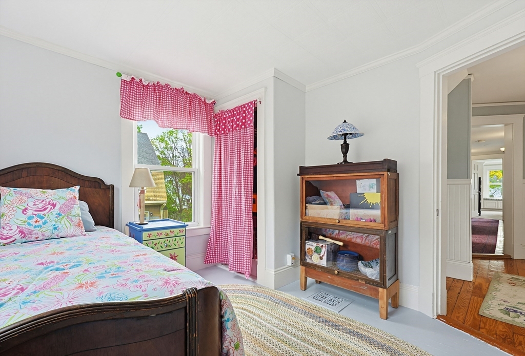 24 Riverside Place Walpole, MA 02081 - Photo 30 of 39 a bedroom with a bed and a large window