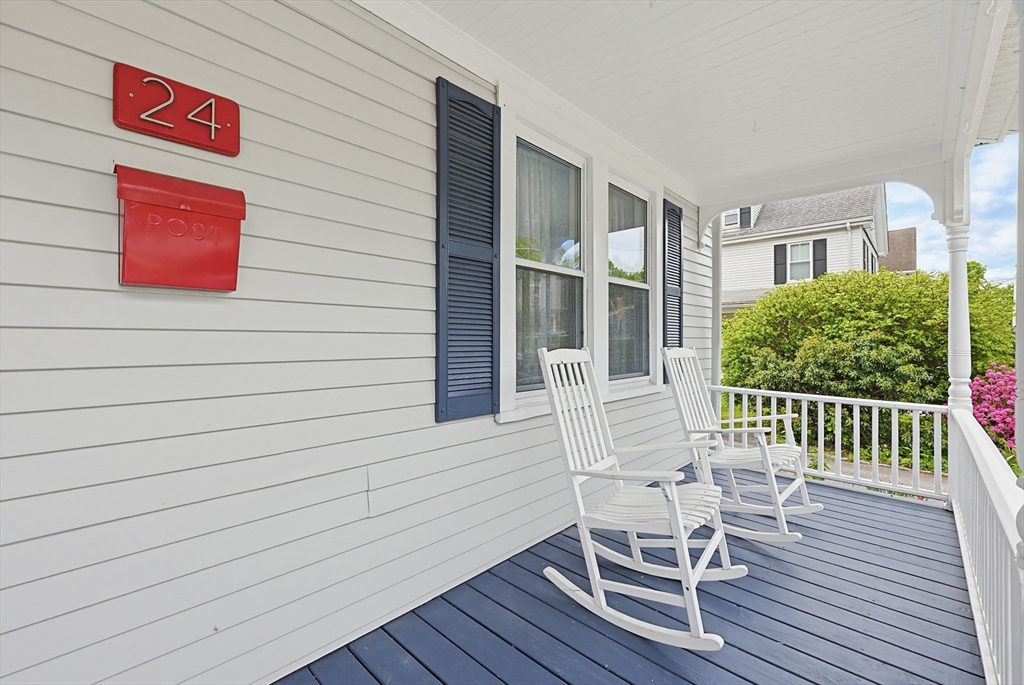 24 Riverside Place Walpole, MA 02081 - Photo 3 of 39 a view of a chair and table in the balcony