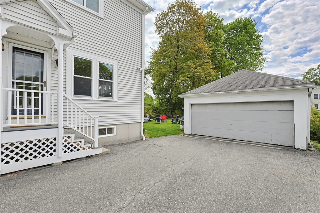 24 Riverside Place Walpole, MA 02081 - Photo 35 of 39 a view of a house with a garage